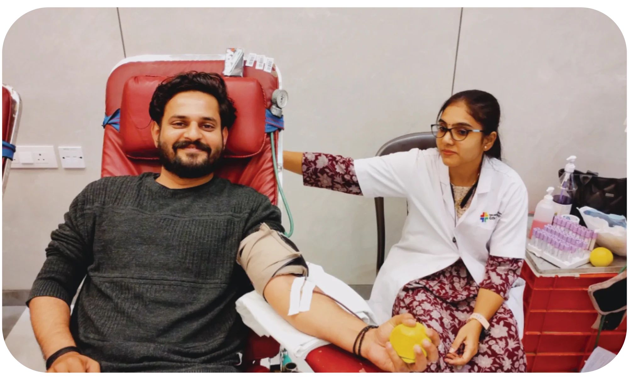 Donor relaxing and smiling after successful blood donation